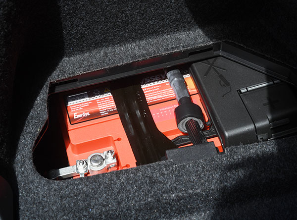 Once all the trunk trim is back in place with only the battery access panel removed, this is what you see. Good thing it's not the old days when people had to add water to batteries. Image: Author.